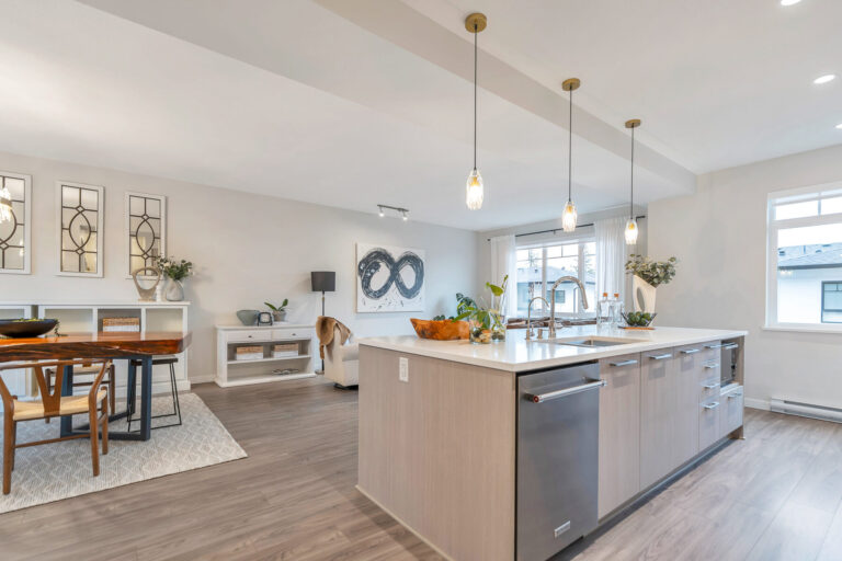Staged kitchen and living area at 138-1360 Mitchell Street in Ballantree North by Polygon