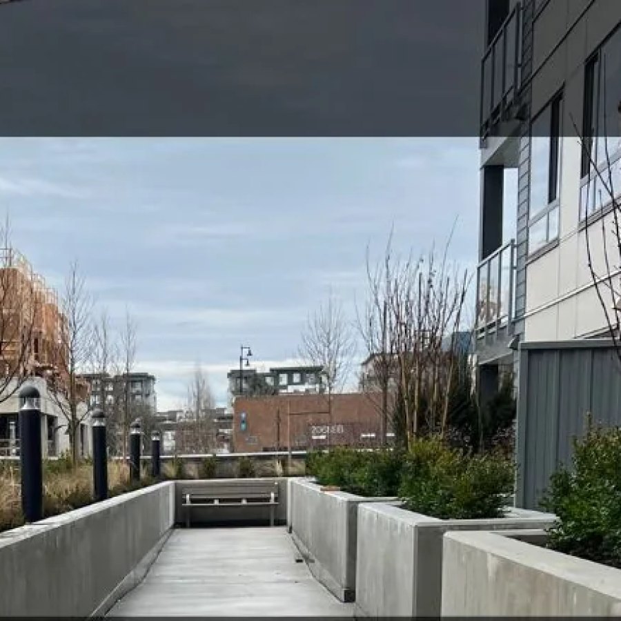 7920 206 Street Hive condo exterior walkway in Langley represented by Liz Penner