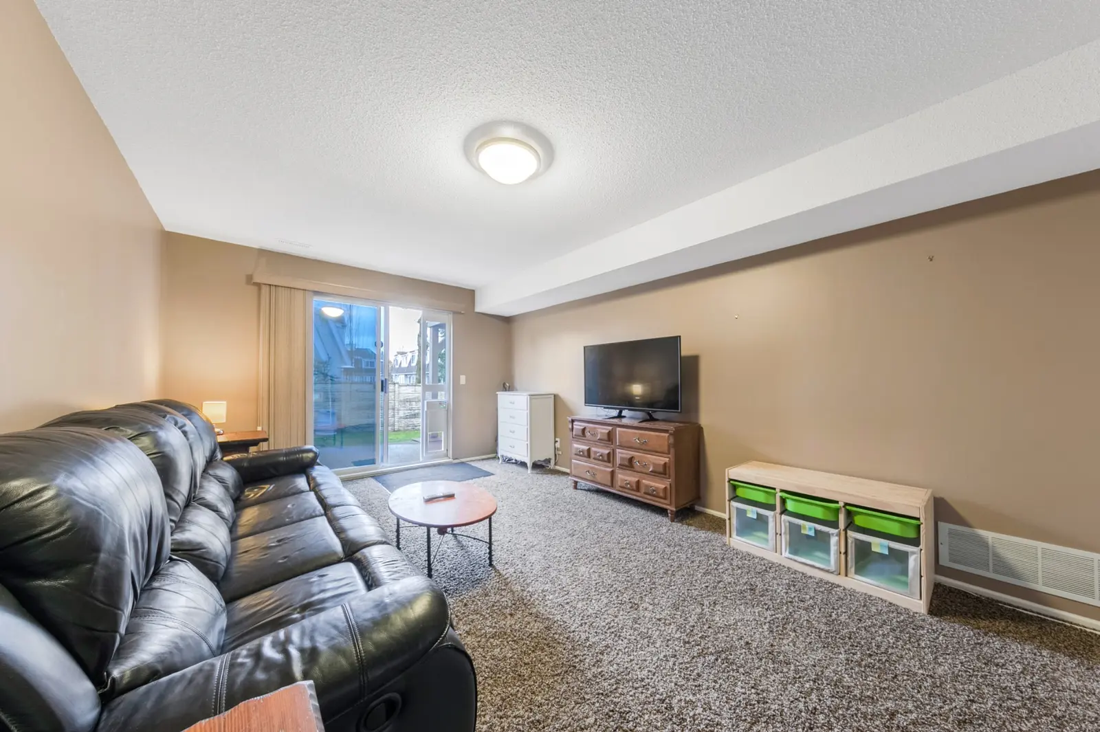 Lower family room in Queen Anne Green Walnut Grove townhome