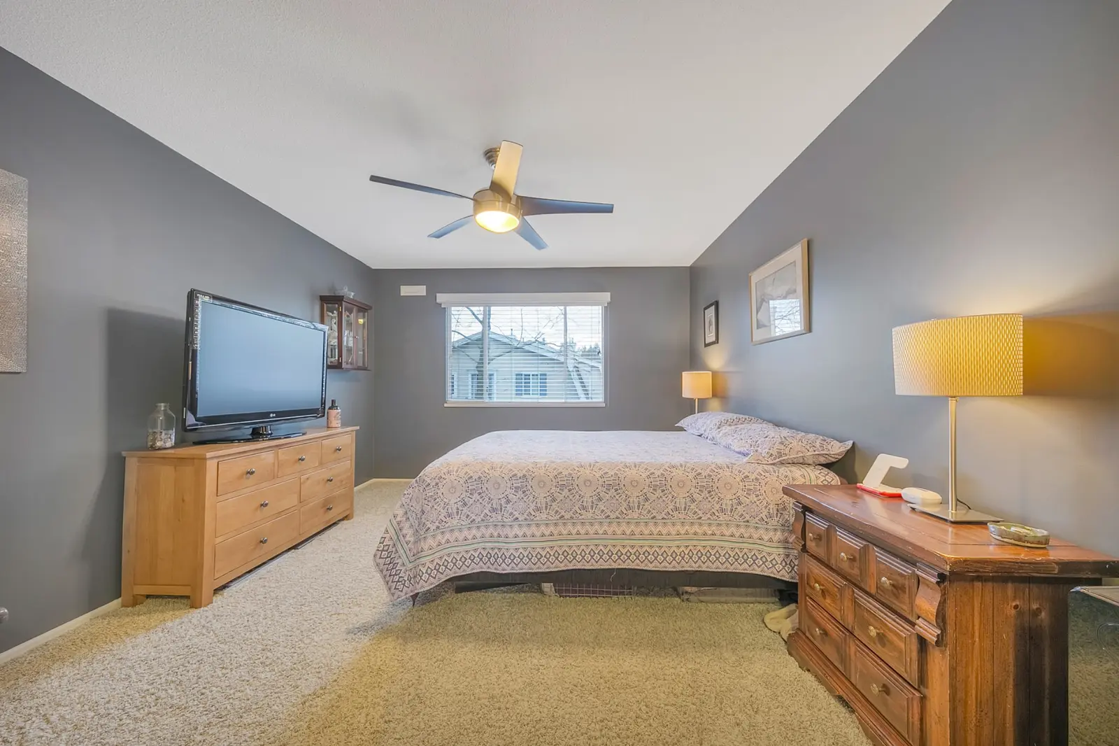 Primary bedroom in Queen Anne Green Walnut Grove townhome