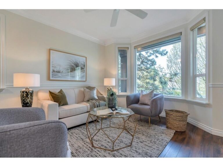 Staged living room at 8846 216 Street in Walnut Grove with a large view window